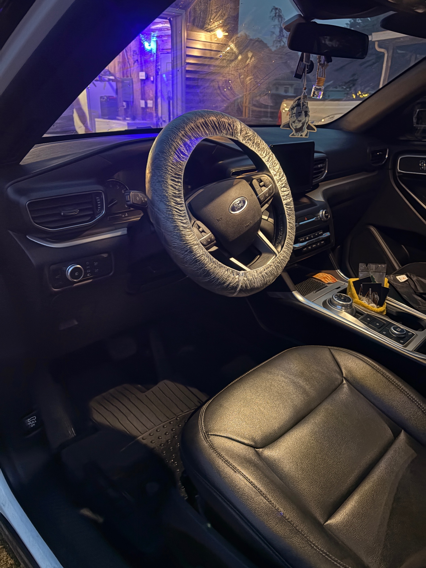 Detailed Ford Explorer interior with clean leather seats and spotless dashboard